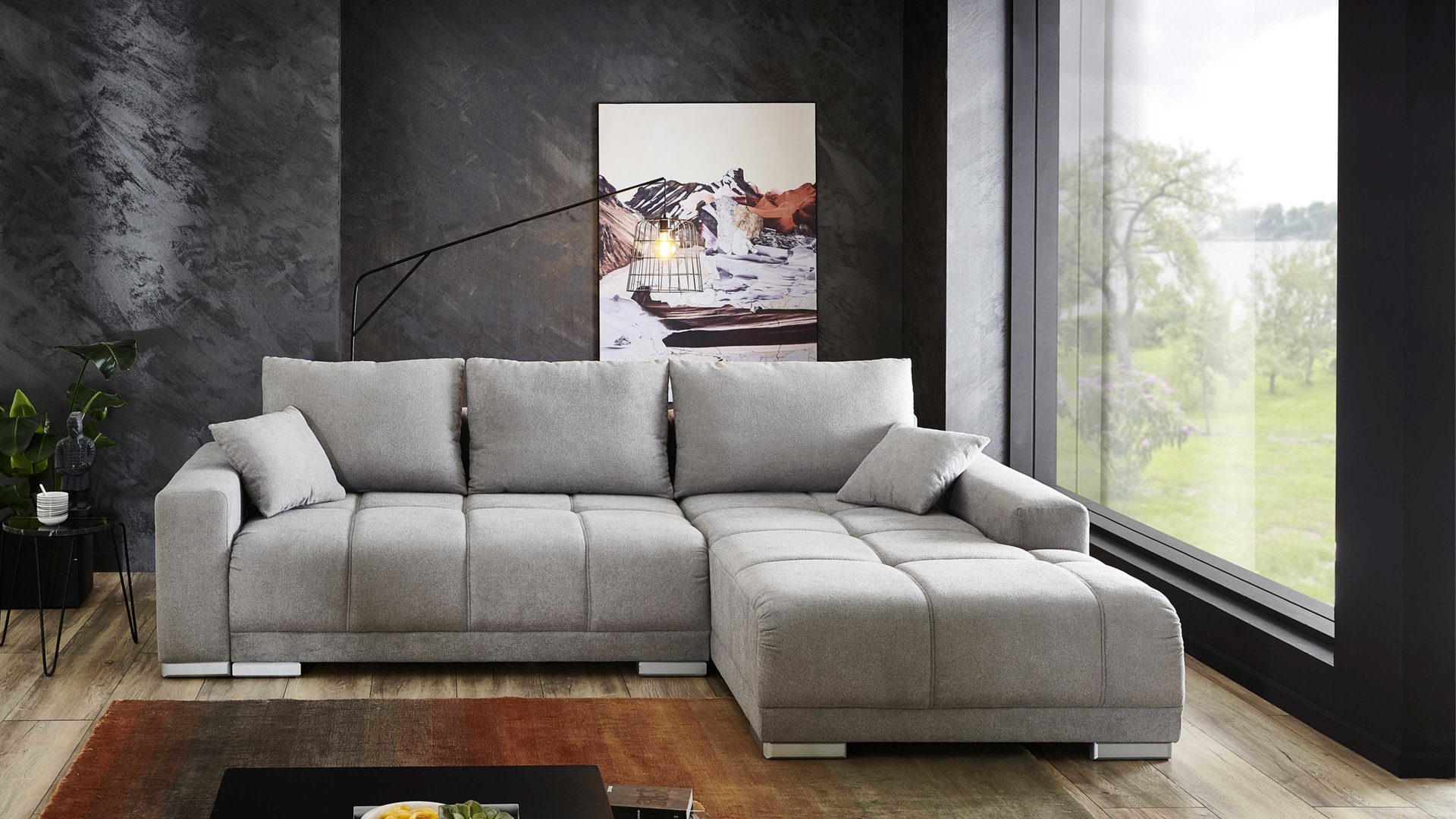 Ecksofa A. z. iwaniccy aus Stoff in Hellgrau Ecksofa mit Schlaffunktion hellgrauer Bezug Camaro 08 & silberfarbene Füße - Stellfläche ca. 269 x 190 cm