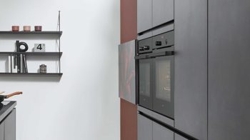 Einbauküche Nobilia® aus Holz in Schwarz nobilia® Einbauküche Laser mit zwei Backöfen Schwarzbeton - zweizeilig
